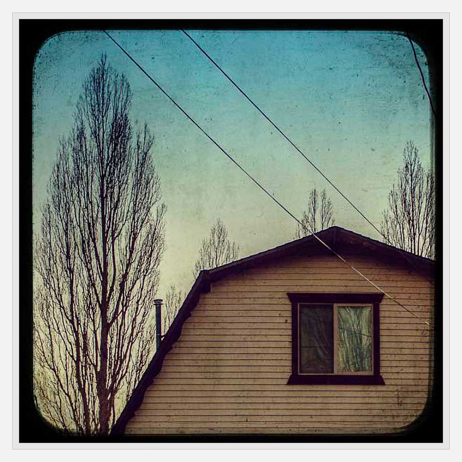 This evocative artwork depicts a serene scene with a vintage aesthetic. The artwork captures a dwelling beneath a tranquil sky with subtle hints of a wintery ambiance, offering a moment of peace.