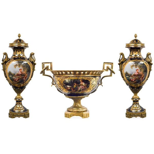 7712-81156CA PC720101 Hand-Painted Dark Blue & Gold Porcelain Centerpiece with European Figures and Bronze Accents (23L X 16W X 16H)